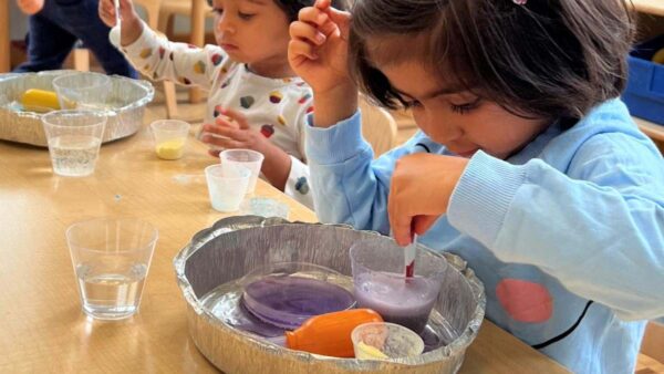 Children experimenting with baking soda and vinegar