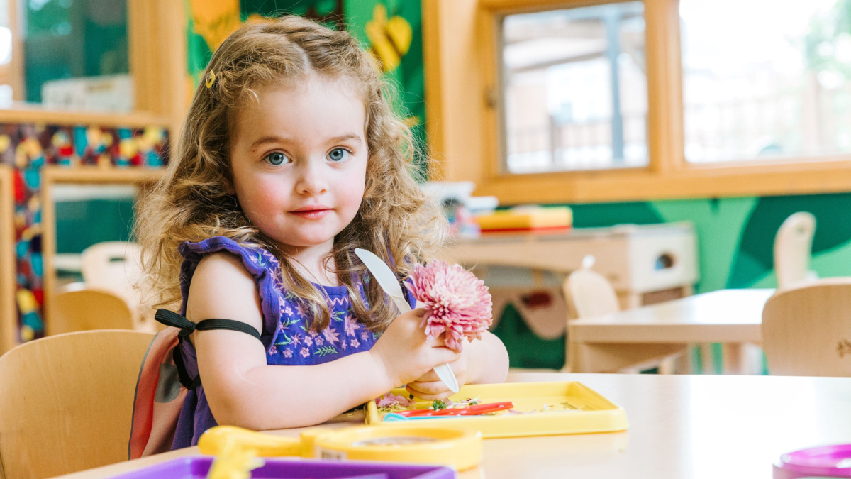 Girl playing with flowers